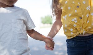 Two kiddos holding hands